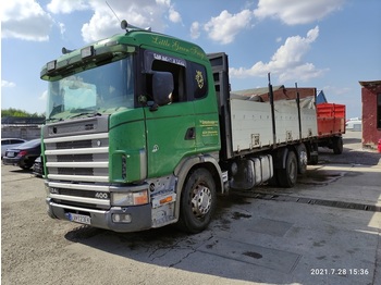 Camion platformă pentru transport de materialelor în vrac SCANIA R124: Foto 1