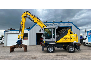 Excavator pentru manipulare de materiale TEREX