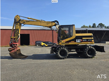 Excavator pe roţi CATERPILLAR M315