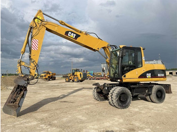 Excavator pe roţi CAT M315C: Foto 3