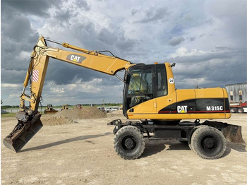 Excavator pe roţi CAT M315C: Foto 4