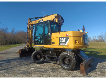 Excavator pe roţi CATERPILLAR M313D