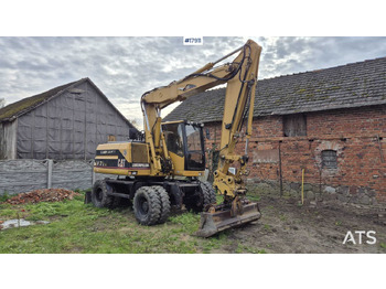 Excavator pe roţi CATERPILLAR M312