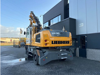 Excavator pentru manipulare de materiale pentru transport de deşeurilor Liebherr LH 30 M: Foto 4