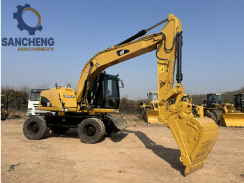 Excavator pe roţi CATERPILLAR M320