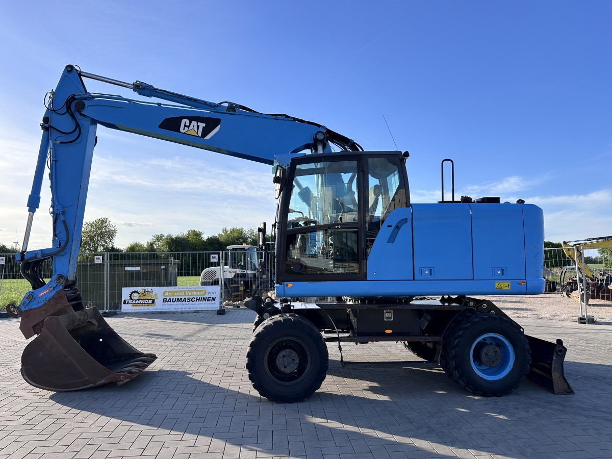 CATERPILLAR M 318 F Oil Quick OQ 65 Deutsche Maschine Top ! - Excavator pe roţi: Foto 1 CATERPILLAR M 318 F Oil Quick OQ 65 Deutsche Maschine Top ! - Excavator pe roţi: Foto 1