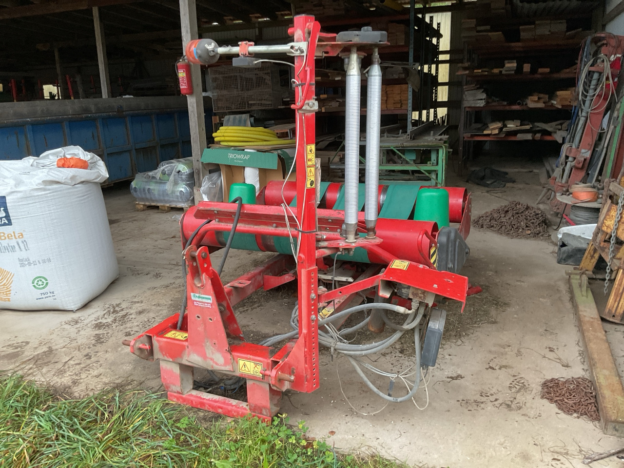 Kverneland 7558 - Maşina de infoliat baloti: Foto 1 Kverneland 7558 - Maşina de infoliat baloti: Foto 1