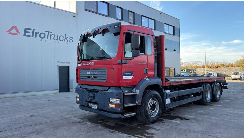 MAN TGA 26.360 (6X4 / STEEL SUSP / LAMES / MANUAL PUMP / BOITE MANUELLE / MANUAL GEARBOX) - Camion platformă: Foto 1 MAN TGA 26.360 (6X4 / STEEL SUSP / LAMES / MANUAL PUMP / BOITE MANUELLE / MANUAL GEARBOX) - Camion platformă: Foto 1