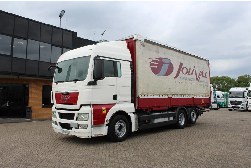 MAN TGX 26.440 * EURO5 * 6X2 * LIFT AXLE * - Camion cu prelată: Foto 1 MAN TGX 26.440 * EURO5 * 6X2 * LIFT AXLE * - Camion cu prelată: Foto 1