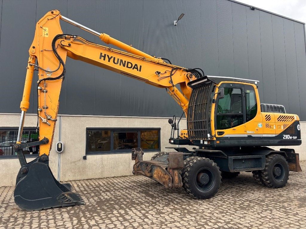 Hyundai Robex 210 W-9 A - 210 W - 200 W - 180 W - Excavator pe roţi: Foto 1 Hyundai Robex 210 W-9 A - 210 W - 200 W - 180 W - Excavator pe roţi: Foto 1