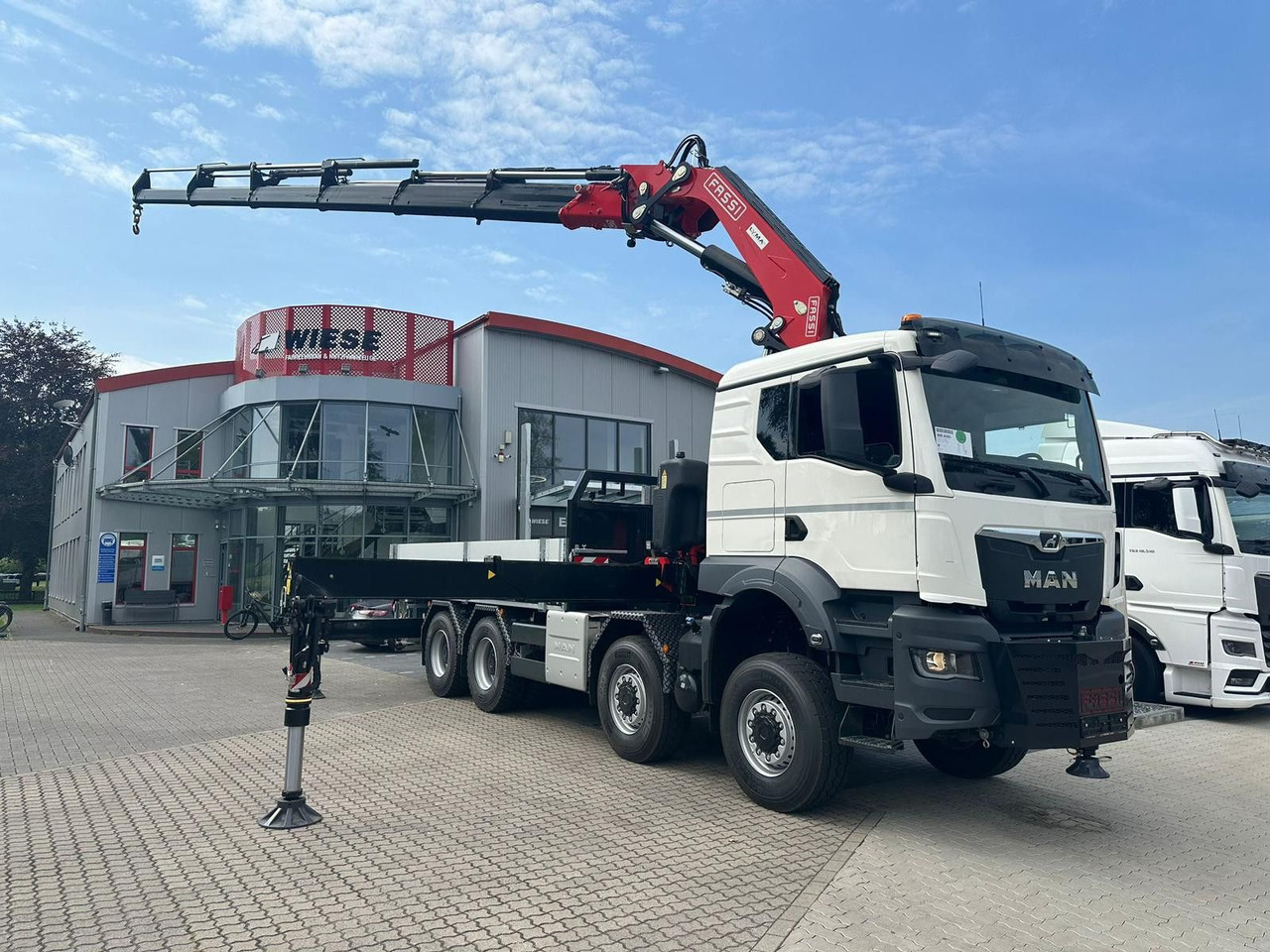 MAN TGS 41.520 8x8 mit Fassi Ladekran F710RA.2.26 - Camion platformă: Foto 1 MAN TGS 41.520 8x8 mit Fassi Ladekran F710RA.2.26 - Camion platformă: Foto 1