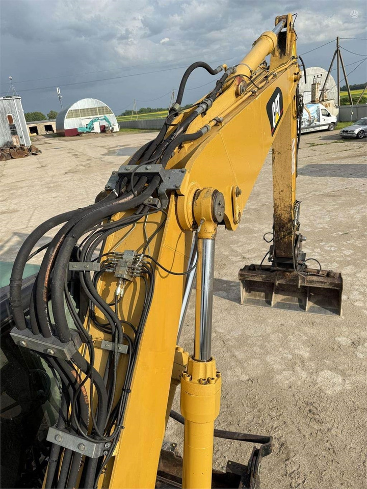 Excavator pe roţi CAT M315C: Foto 20