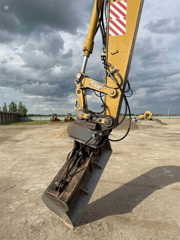 Excavator pe roţi CAT M315C: Foto 9