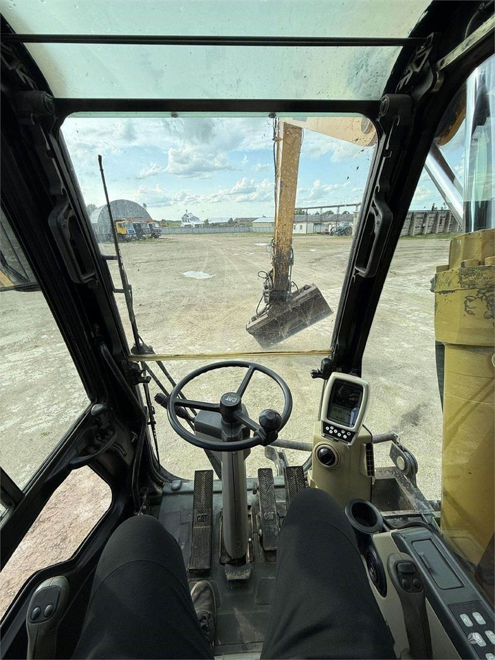 Excavator pe roţi CAT M315C: Foto 12