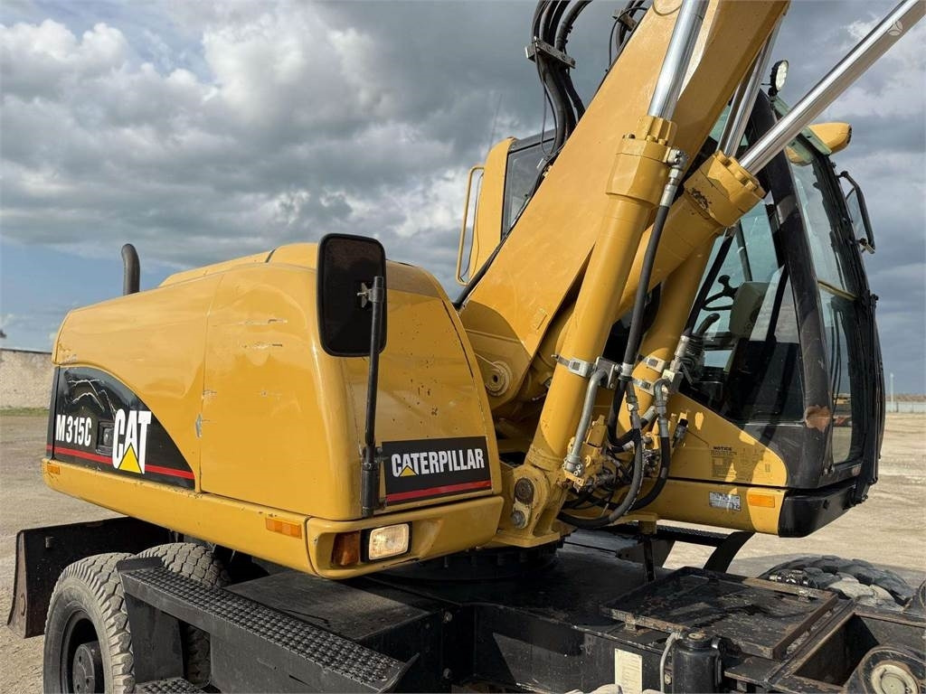 Excavator pe roţi CAT M315C: Foto 17