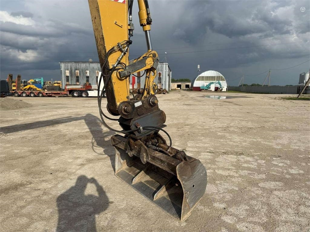 Excavator pe roţi CAT M315C: Foto 10