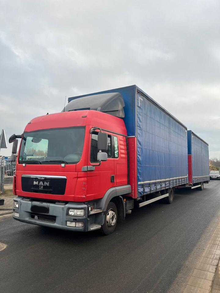 MAN 8.220 4X2 Pritschenwagen - Camion cu prelată: Foto 1 MAN 8.220 4X2 Pritschenwagen - Camion cu prelată: Foto 1
