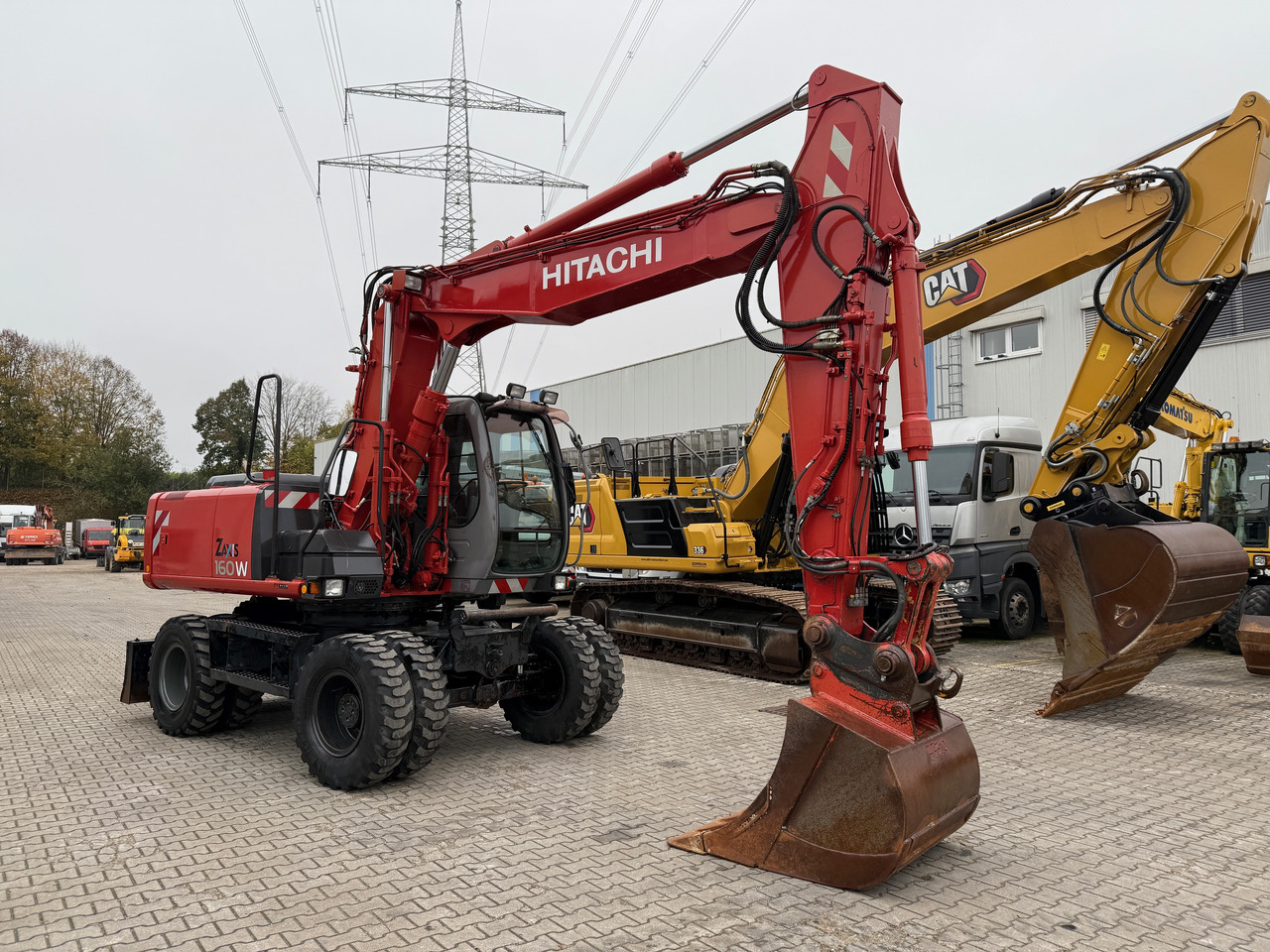 Hitachi ZX 160 W Mobilbagger Klima Zentralschmierung OQ 60-5 - Excavator pe roţi: Foto 3 Hitachi ZX 160 W Mobilbagger Klima Zentralschmierung OQ 60-5 - Excavator pe roţi: Foto 3
