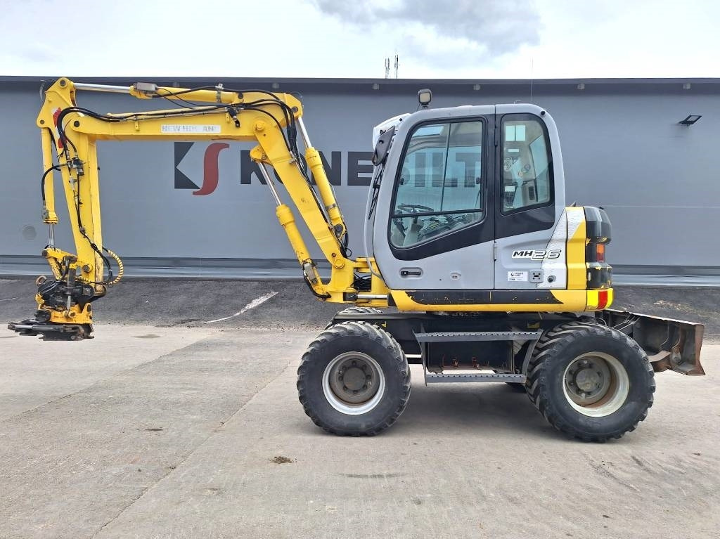 New Holland MYYTY! SOLD! MH2.6 ENGCON PIHDEILLÄ - Excavator pe roţi: Foto 1 New Holland MYYTY! SOLD! MH2.6 ENGCON PIHDEILLÄ - Excavator pe roţi: Foto 1