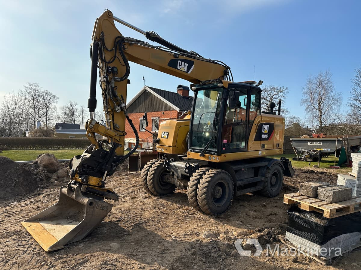 Hjulgrävare Cat M314F + redskap/vagn/grävsystem - Excavator pe şenile: Foto 1 Hjulgrävare Cat M314F + redskap/vagn/grävsystem - Excavator pe şenile: Foto 1