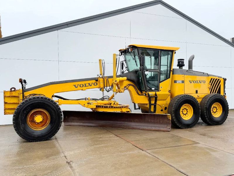 Volvo G990 - 4.85m Blade / Pushblock / Airco - Autogreder: Foto 1 Volvo G990 - 4.85m Blade / Pushblock / Airco - Autogreder: Foto 1