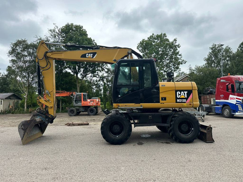 Cat M 313 D - Excavator pe roţi: Foto 1 Cat M 313 D - Excavator pe roţi: Foto 1