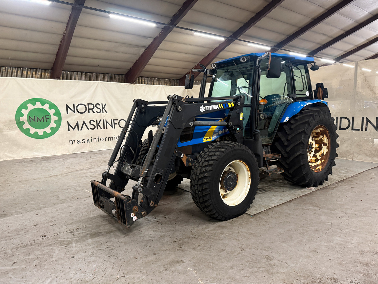 New Holland T5060 - Tractor agricol: Foto 1 New Holland T5060 - Tractor agricol: Foto 1