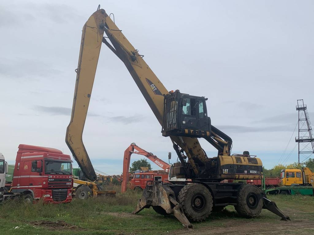 CAT M 325 C L MH - Excavator pentru manipulare de materiale: Foto 1 CAT M 325 C L MH - Excavator pentru manipulare de materiale: Foto 1