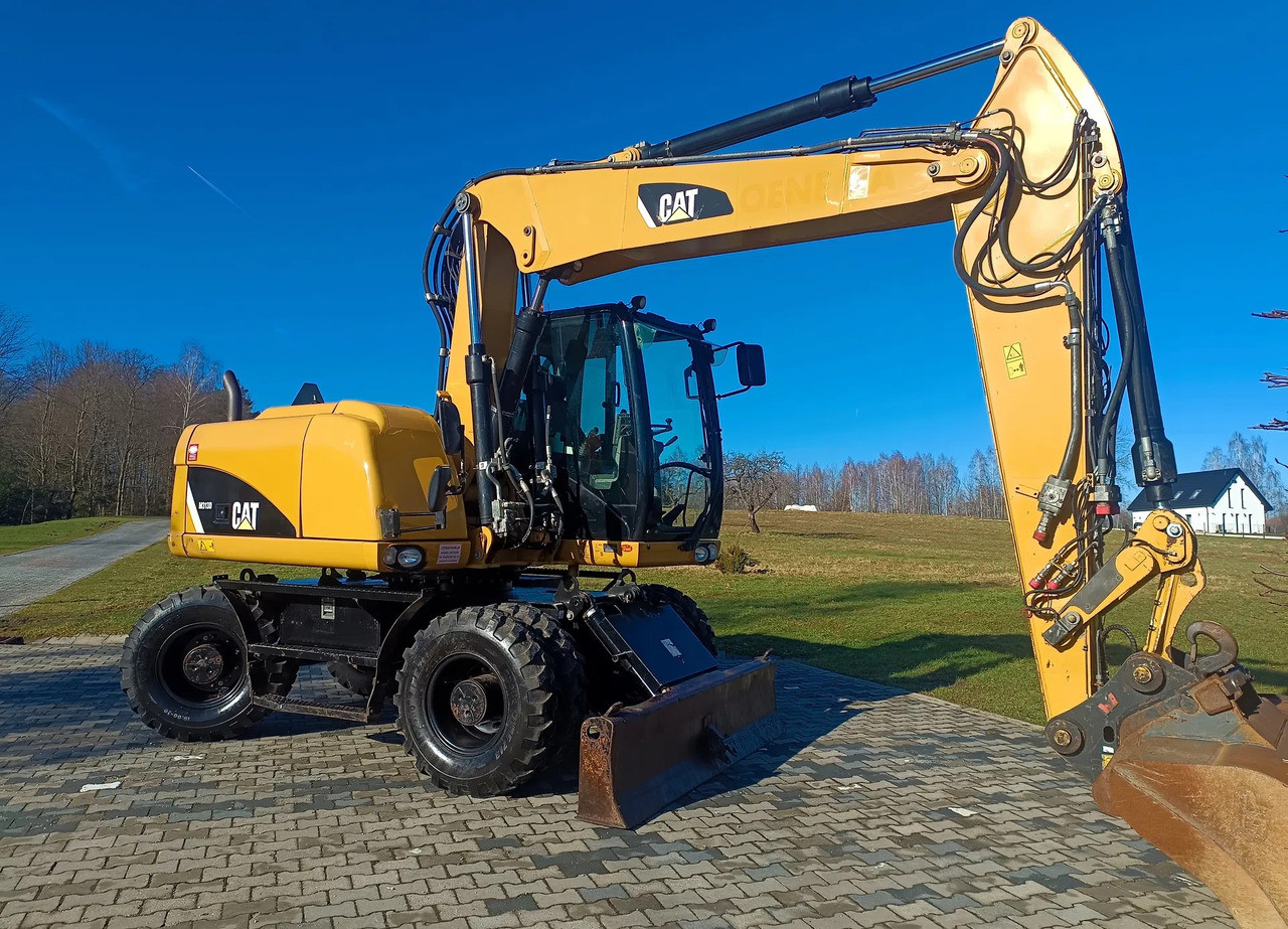 CATERPILLAR M313D - Excavator pe roţi: Foto 2 CATERPILLAR M313D - Excavator pe roţi: Foto 2