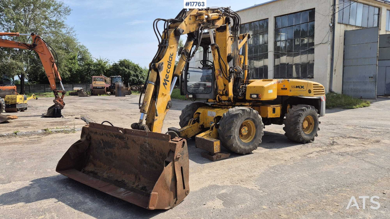 MECALAC 12MX wheeled excavator (1996) - Excavator pe roţi: Foto 1 MECALAC 12MX wheeled excavator (1996) - Excavator pe roţi: Foto 1