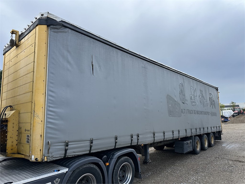 Schmitz Cargobull Machine transport trailer with bag ramp - Semiremorcă transport agabaritic: Foto 1 Schmitz Cargobull Machine transport trailer with bag ramp - Semiremorcă transport agabaritic: Foto 1