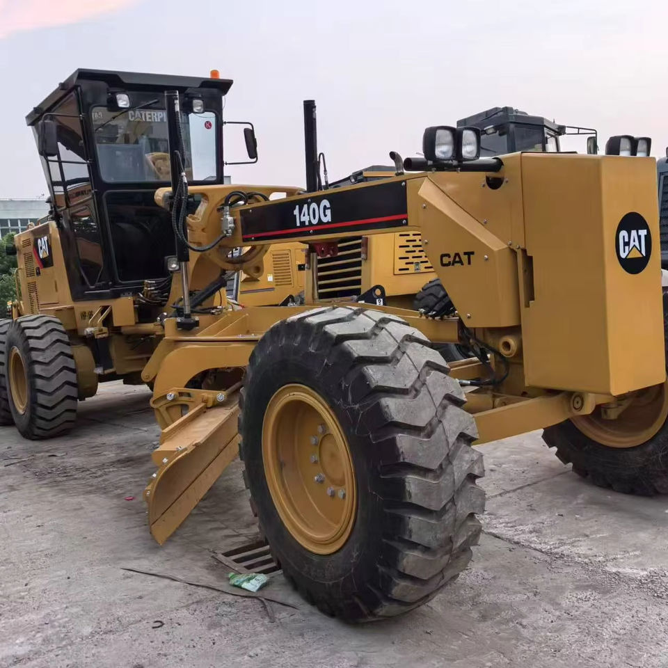 Second Hand Used Construction Machinery Japanese CAT 140G Grader Caterpillar Brand for Sale With Good Condition and Price - Autogreder: Foto 1 Second Hand Used Construction Machinery Japanese CAT 140G Grader Caterpillar Brand for Sale With Good Condition and Price - Autogreder: Foto 1