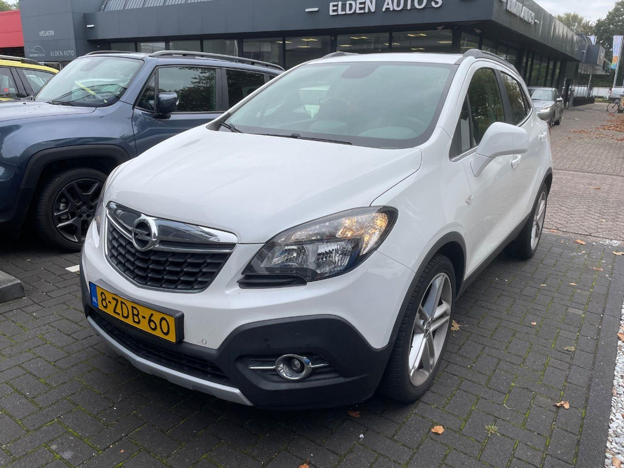 Opel Mokka 1.4 T Cosmo | 2014 | 98.606 km | 8ZDB60 | NAP: Logisch - SUV: Foto 1 Opel Mokka 1.4 T Cosmo | 2014 | 98.606 km | 8ZDB60 | NAP: Logisch - SUV: Foto 1