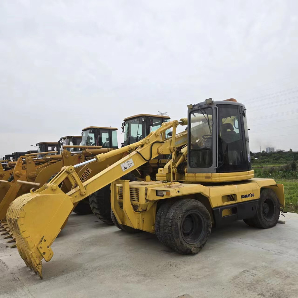 KOMATSU PC128US - Excavator pe roţi: Foto 1 KOMATSU PC128US - Excavator pe roţi: Foto 1