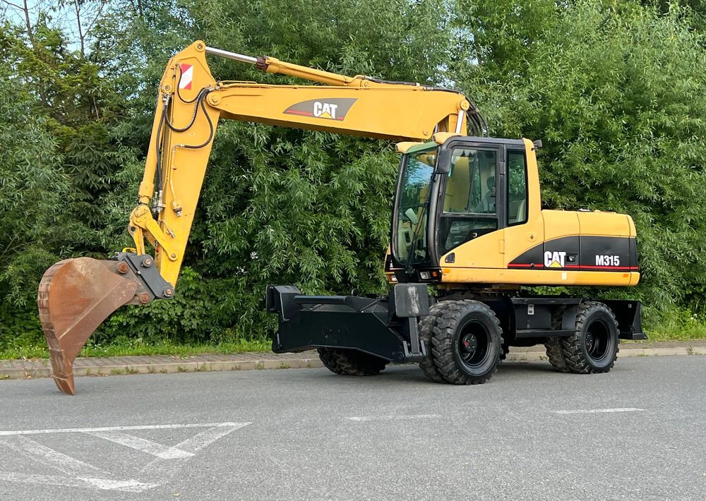 Caterpillar CAT M315C CATERPILLAR SPROWADZONY Bardzo Dobry Stan - Excavator pe roţi: Foto 1 Caterpillar CAT M315C CATERPILLAR SPROWADZONY Bardzo Dobry Stan - Excavator pe roţi: Foto 1