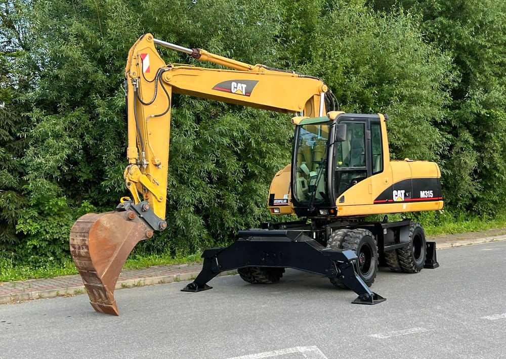 Caterpillar CAT M315C CATERPILLAR SPROWADZONY Bardzo Dobry Stan - Excavator pe roţi: Foto 1 Caterpillar CAT M315C CATERPILLAR SPROWADZONY Bardzo Dobry Stan - Excavator pe roţi: Foto 1