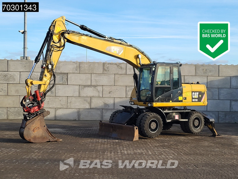 Caterpillar M315 D OUTRIGGERS + BLADE - Excavator pe roţi: Foto 1 Caterpillar M315 D OUTRIGGERS + BLADE - Excavator pe roţi: Foto 1