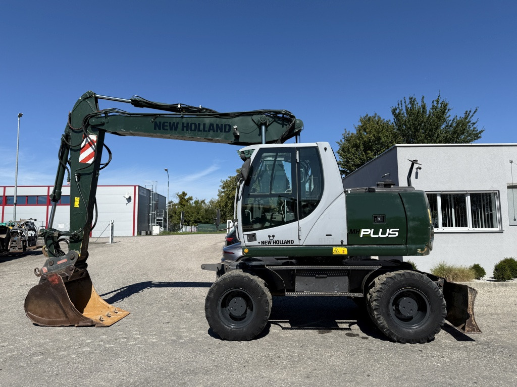 New Holland MH-Plus (111695) - Excavator pe roţi: Foto 1 New Holland MH-Plus (111695) - Excavator pe roţi: Foto 1