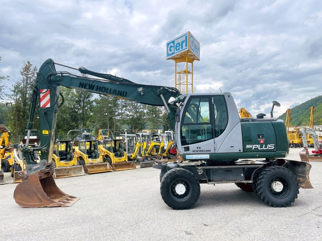 New Holland MH Plus (4054) - Excavator pe roţi: Foto 1 New Holland MH Plus (4054) - Excavator pe roţi: Foto 1