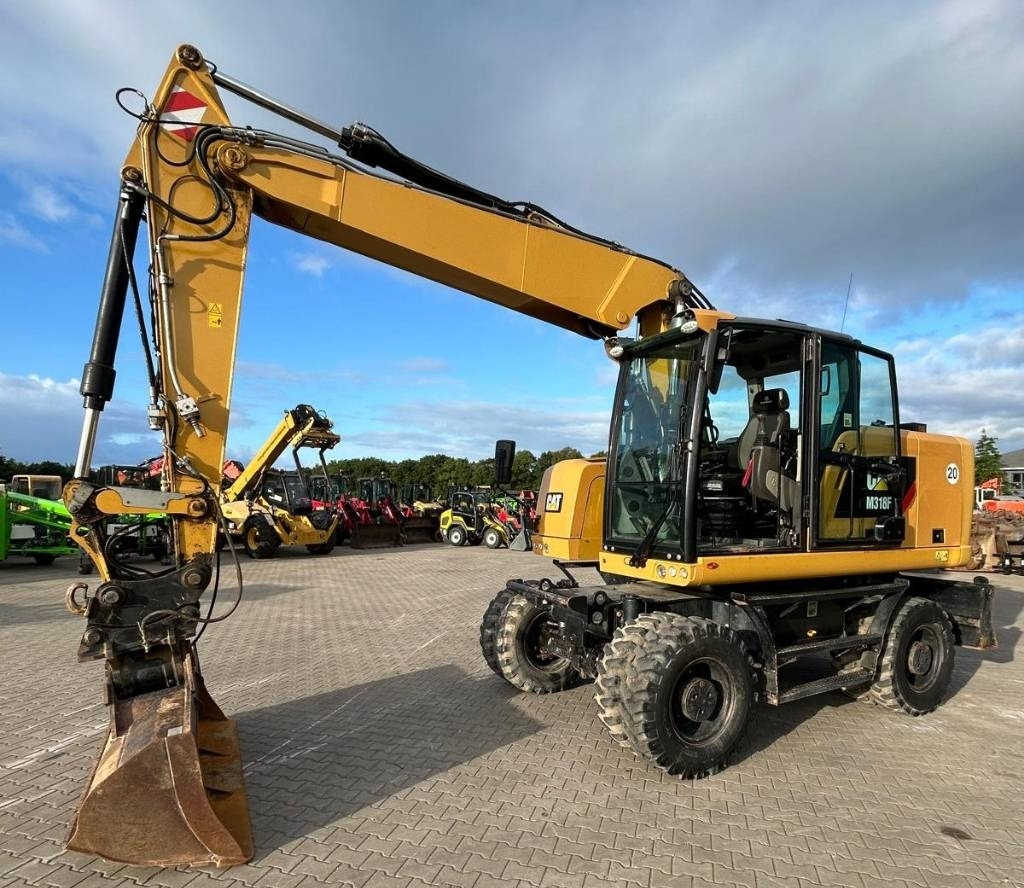 CAT M 318 F - Excavator pe roţi: Foto 1 CAT M 318 F - Excavator pe roţi: Foto 1