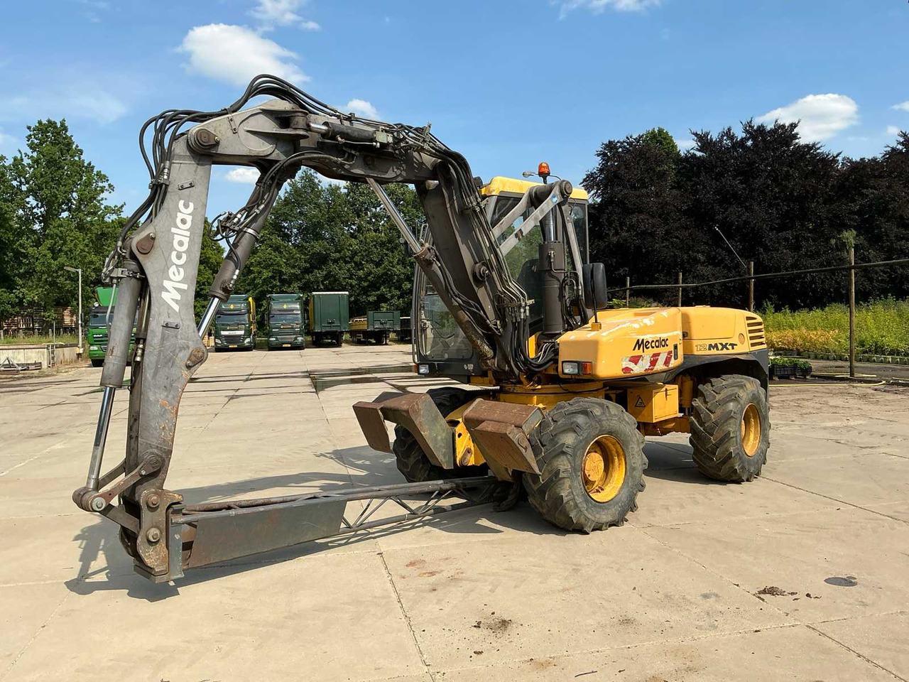 Mecalac 12MXT - Buldoexcavator: Foto 1 Mecalac 12MXT - Buldoexcavator: Foto 1