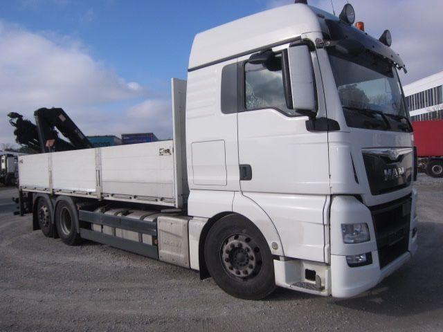 MAN TGX 26.440 mit Hiab-Kran Funkfernbedienung - Camion platformă, Camion cu macara: Foto 1 MAN TGX 26.440 mit Hiab-Kran Funkfernbedienung - Camion platformă, Camion cu macara: Foto 1