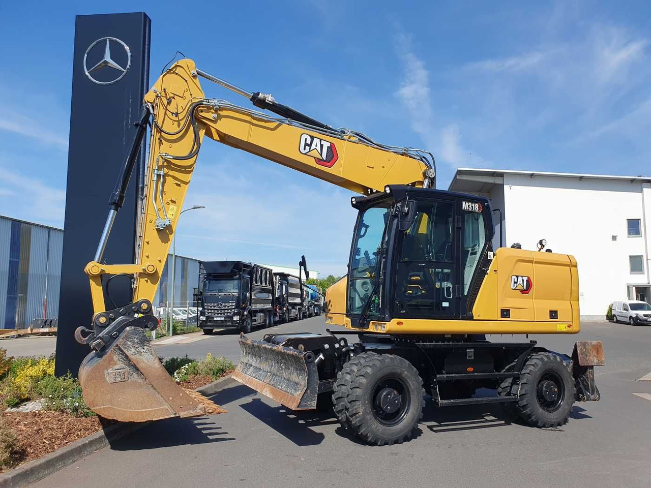 CAT M318 / 2022 / nur 286h! / Tieflöffel / Pratzen - Excavator pe roţi: Foto 1 CAT M318 / 2022 / nur 286h! / Tieflöffel / Pratzen - Excavator pe roţi: Foto 1