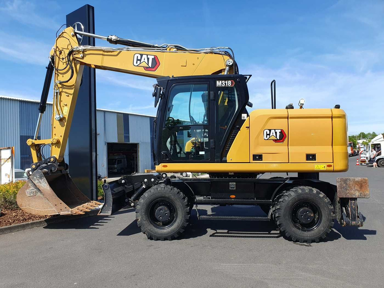 CAT M318 / 2022 / nur 286h! / Tieflöffel / Pratzen - Excavator pe roţi: Foto 2 CAT M318 / 2022 / nur 286h! / Tieflöffel / Pratzen - Excavator pe roţi: Foto 2